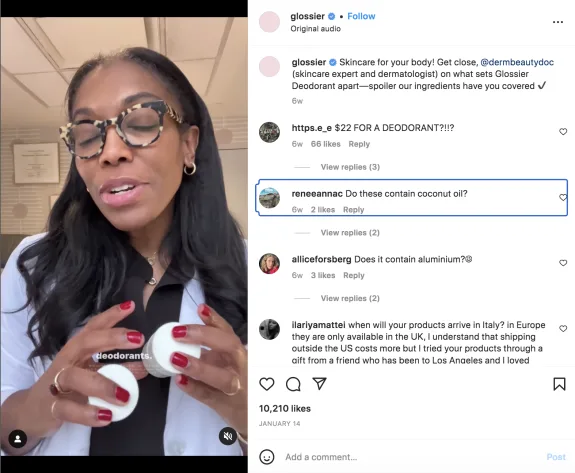Dermatologist holding deodorants, discussing ingredients in a video post.