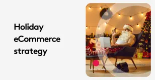 Santa Claus in festive room using laptop for holiday eCommerce strategy.