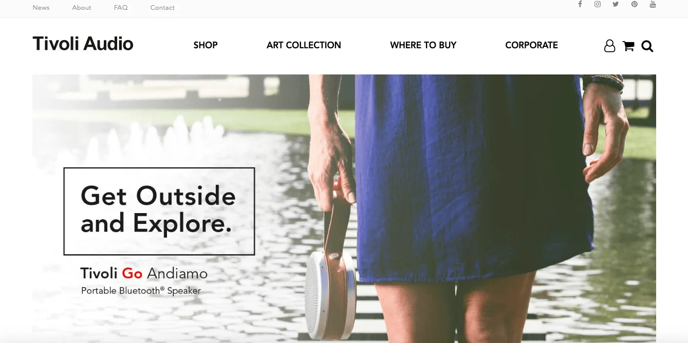 Person holding Tivoli Go Andiamo speaker by a pond with text 'Get Outside and Explore.'